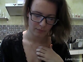 Solo girl with glasses chatting in the kitchen